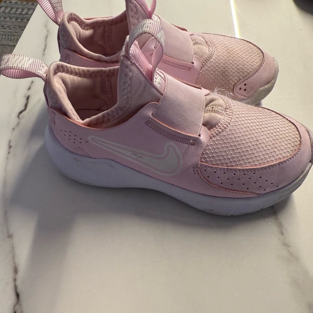 Nike White Slip-On Sneakers with Geometric Pattern